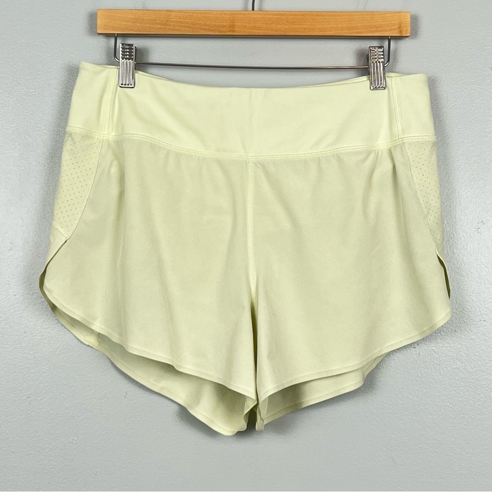 Athleta yellow-green Run With It 3.5β lined running shorts, medium.